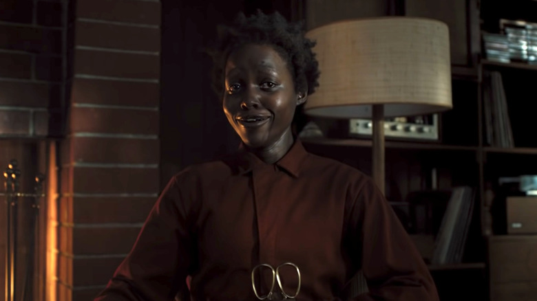 Lupita Nyong'o as Red holding scissors in Us