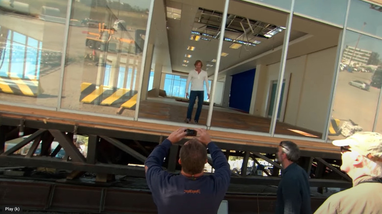 Michael Bay stands in a building set