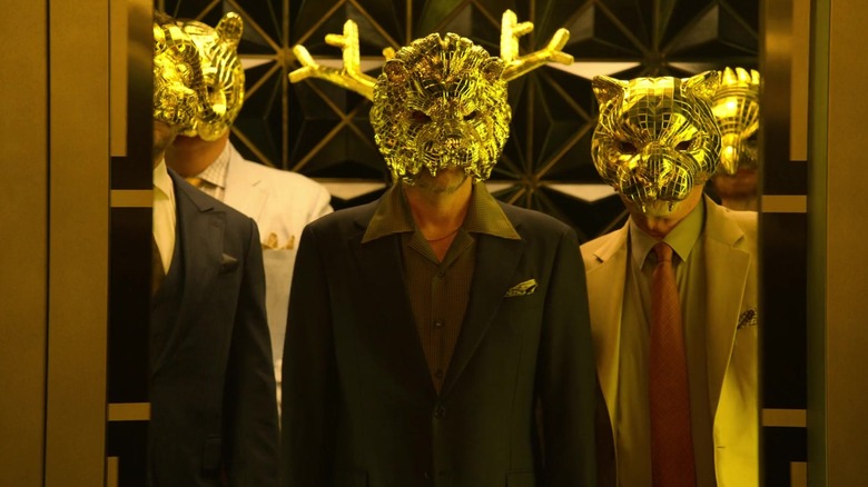 The masked VIPs stepping out of elevator in "Squid Game"