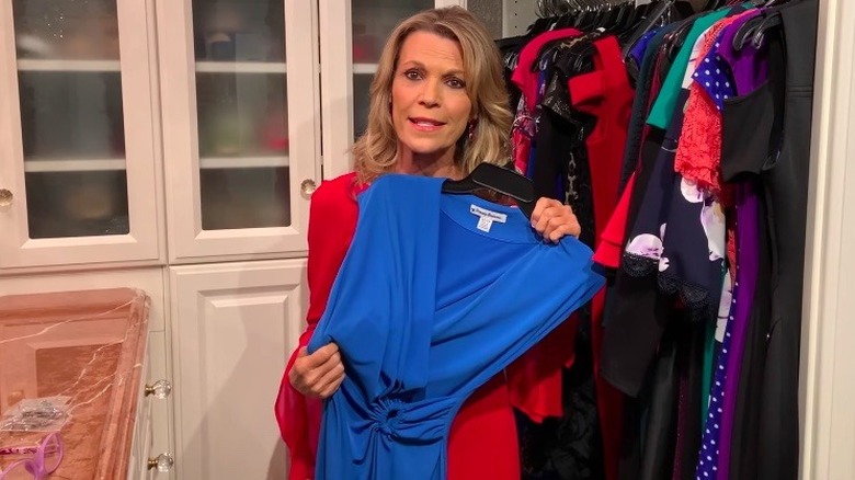 Vanna White holding a dress