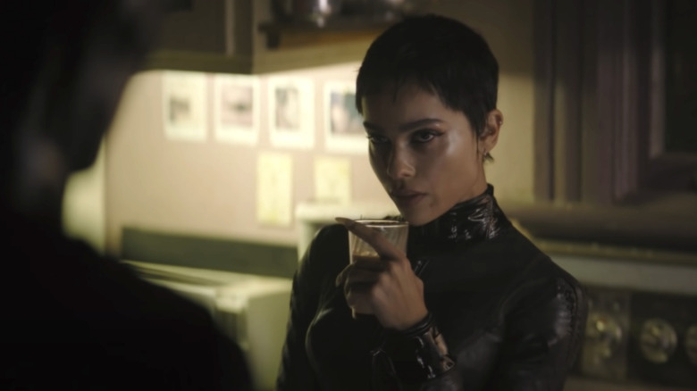 Selina Kyle holding glass of milk