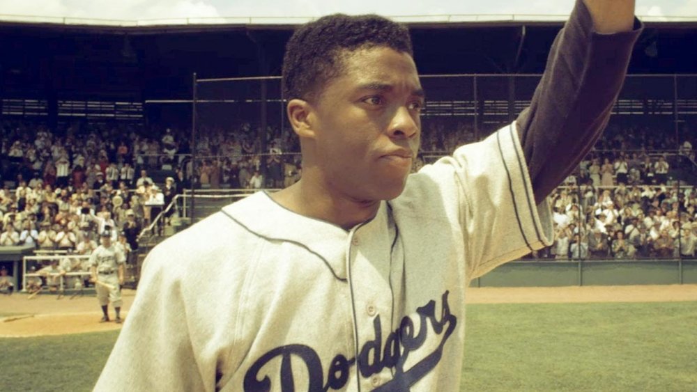 Chadwick Boseman as Jackie Robinson in 42