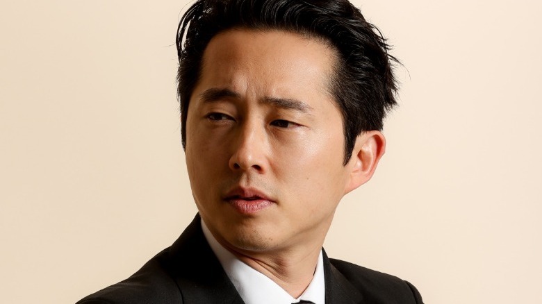 Steven Yeun in jacket and shirt