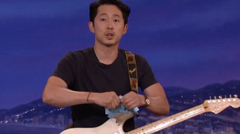 Steven Yeun performing on Conan