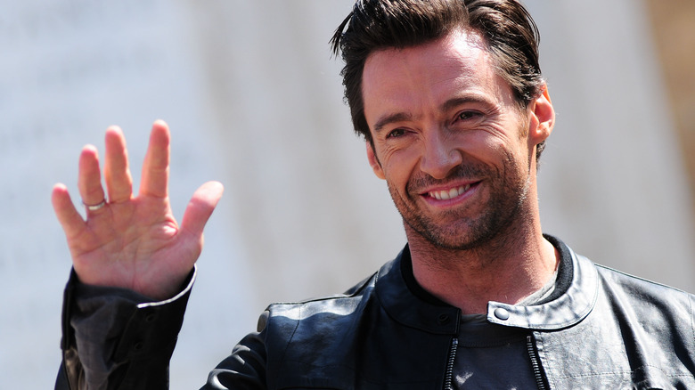 Hugh Jackman waves to fans