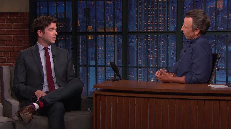 John Mulaney talking with Seth Meyers