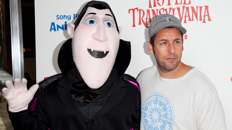 Adam Sandler posing with Dracula