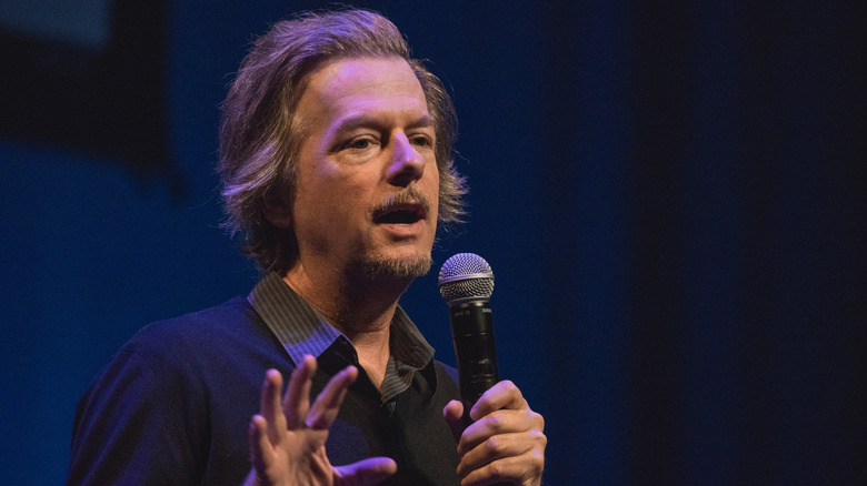 David Spade talking on the mic