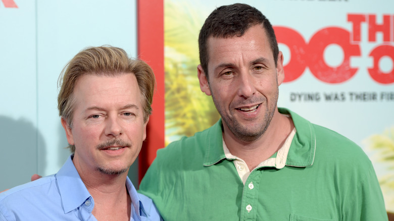 David Spade and Adam Sandler posing together