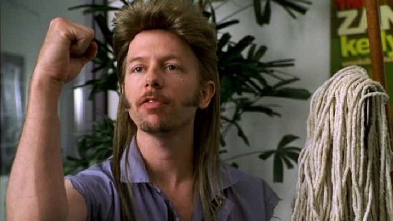 Joe Dirt holding a mop