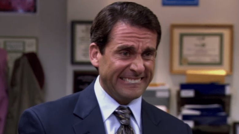 Michael Scott grimacing