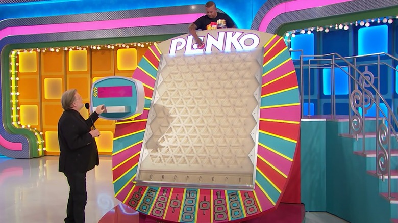 Drew Carey hosting Plinko board