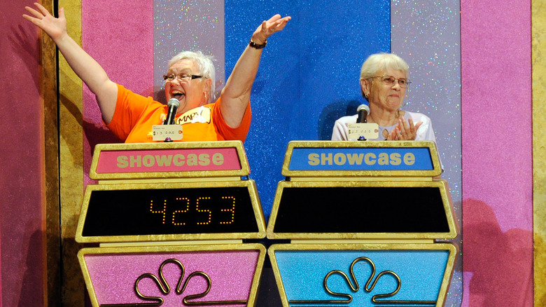 Contestants smile and clap