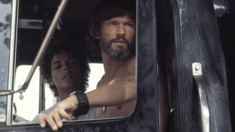 Ali MacGraw rides in a truck