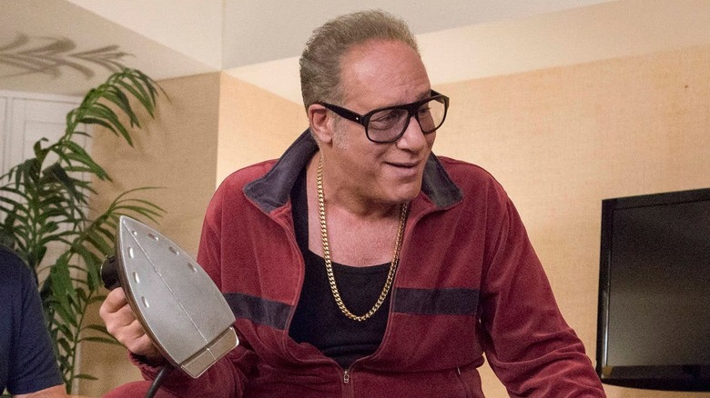 andrew dice clay holding an iron