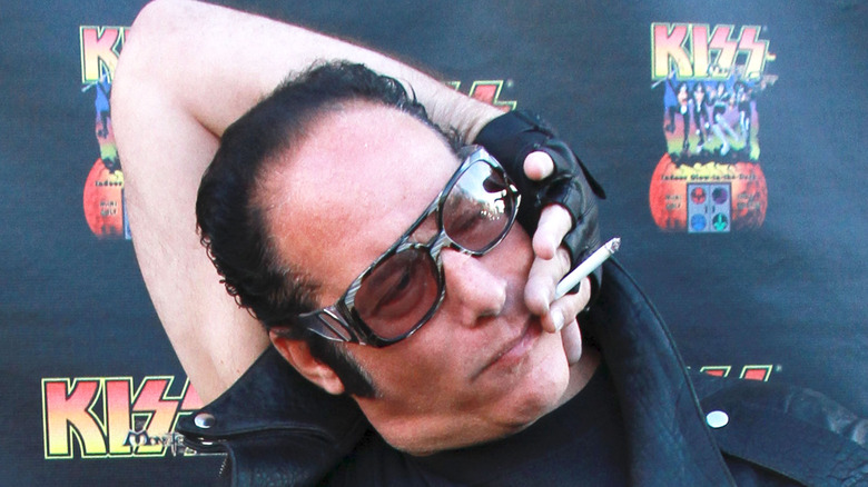 andrew dice clay smoking in weird pose