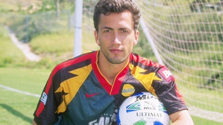 Andrew Shue posing with soccer ball