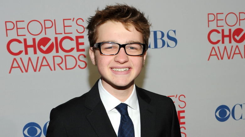 Smiling and bespectacled Angus T. Jones at the People's Choice Awards 2012