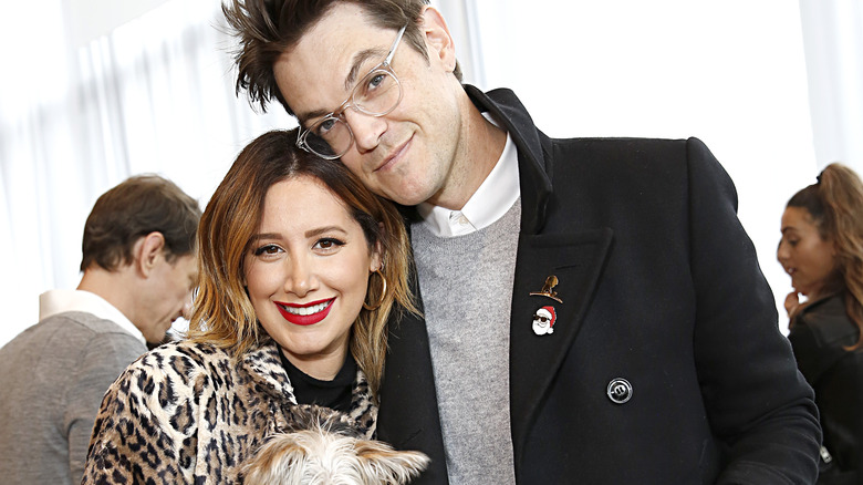 Ashley Tisdale and her husband at a charity event