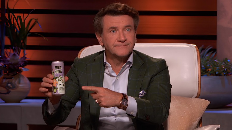 Robert Herjavec pointing to can 