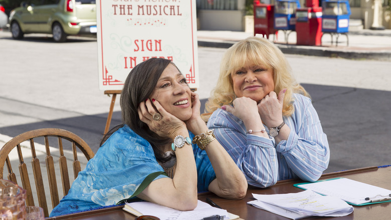 Miss Patty sits next to Babette