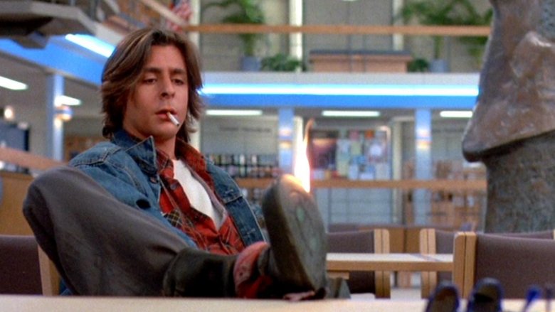 Judd Nelson in The Breakfast Club kicking desk and smoking