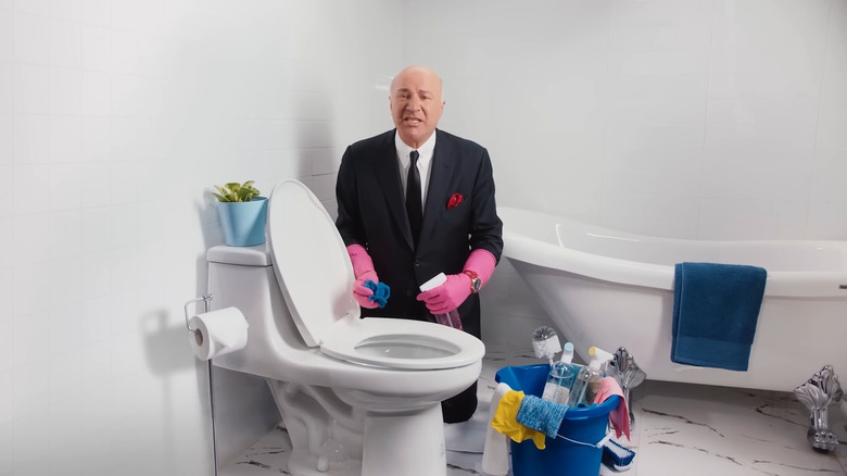 Kevin O'leary next to a toilet