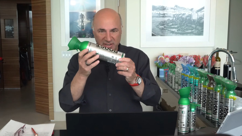 Kevin O'Leary holding bottle of Boost Oxygen