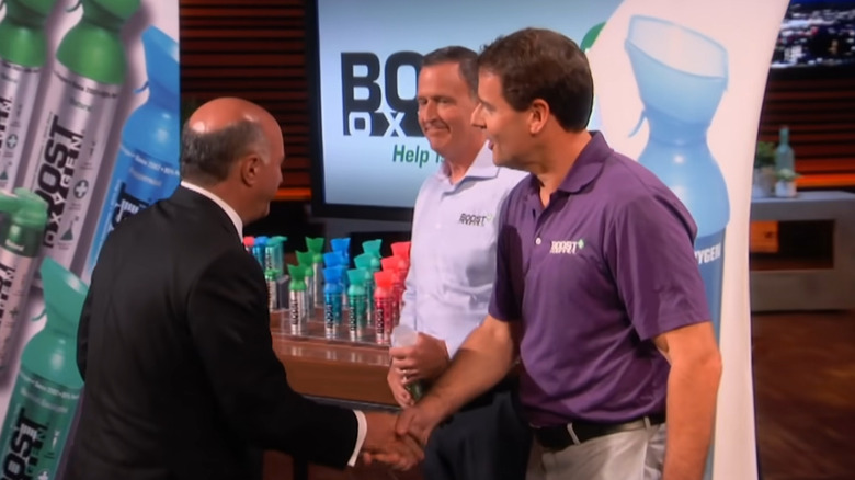 Kevin O' Leary shaking hands with Boost Oxygen team