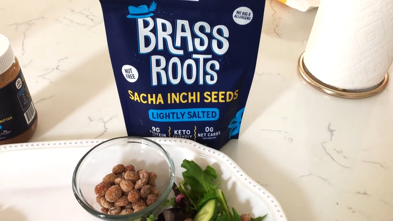 Brass Roots sitting next to a salad