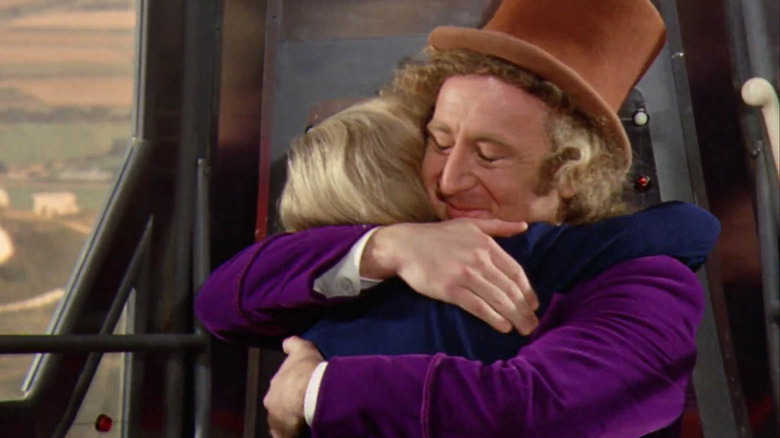 Wonka and Charlie hugging