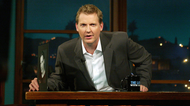 Craig Kilborn behind a desk