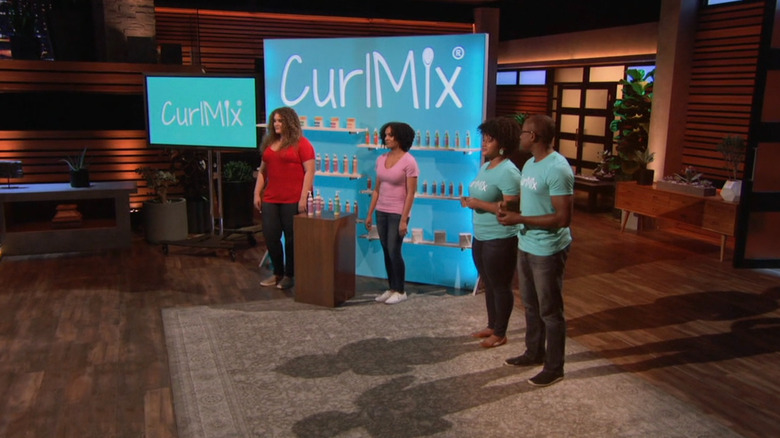 Kim and Tim presenting next to CurlMix