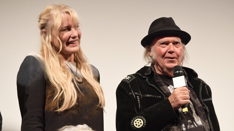 Daryl Hannah and Neil Young on stage