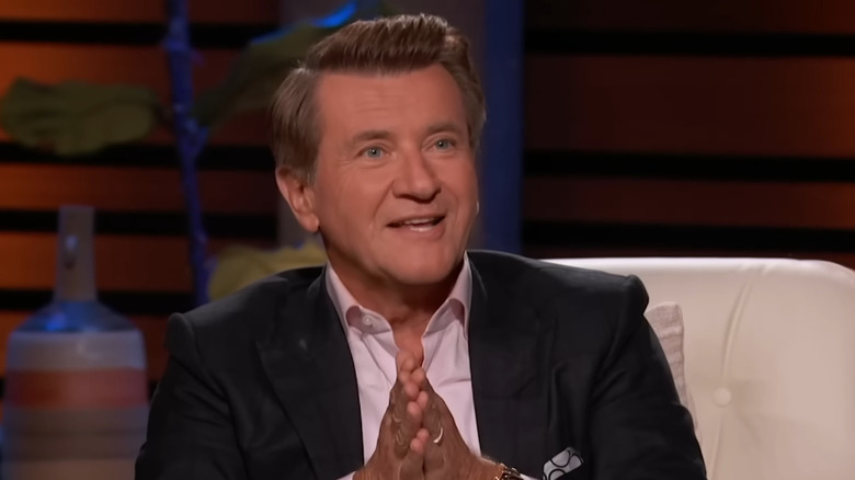 Robert Herjavec smiling with his hands together