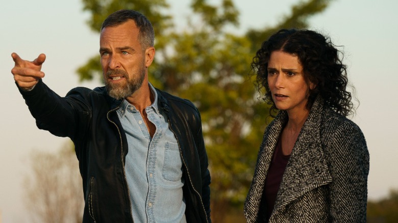 JR Bourne and Melissa Ponzio outdoors