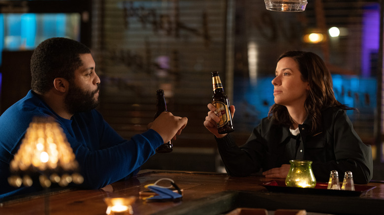 O'Shea Jackson Jr. and Tessa Ferrer drinking beers in Swagger