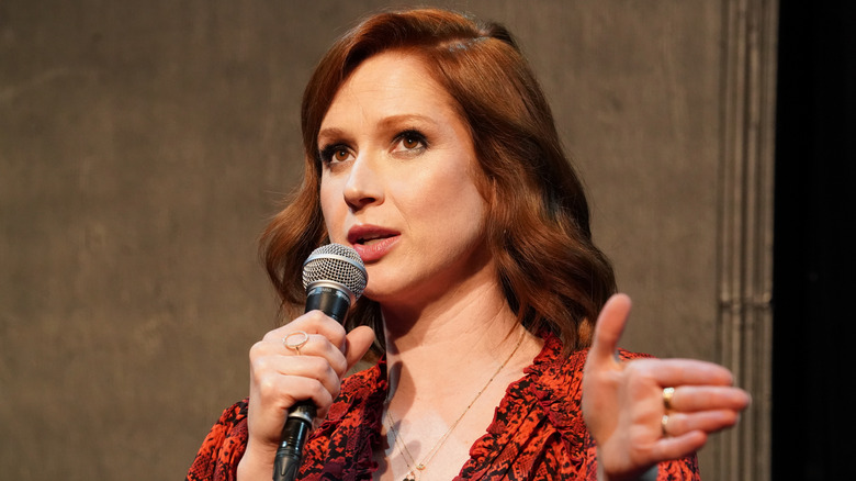 Ellie Kemper speaking into a microphone