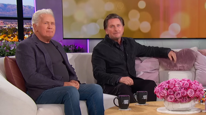 Martin Sheen and Emilio Estevez sitting