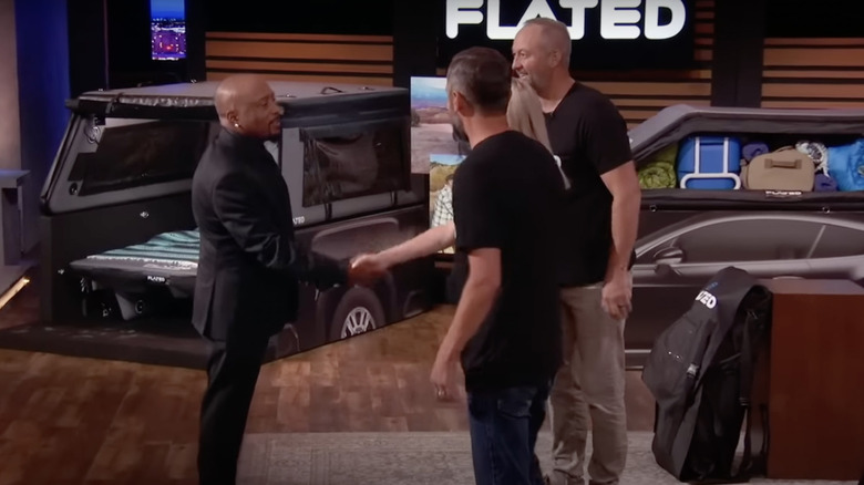 Daymond shaking hands with Monique