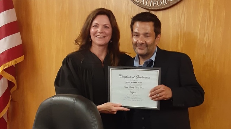 Judge and Weiss holding certificate