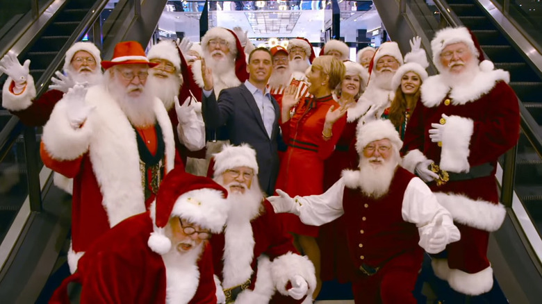 Mitch Allen and Barbara Corcoran with a group of santas