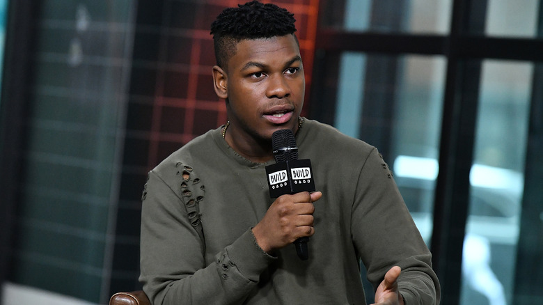 John Boyega with a microphone