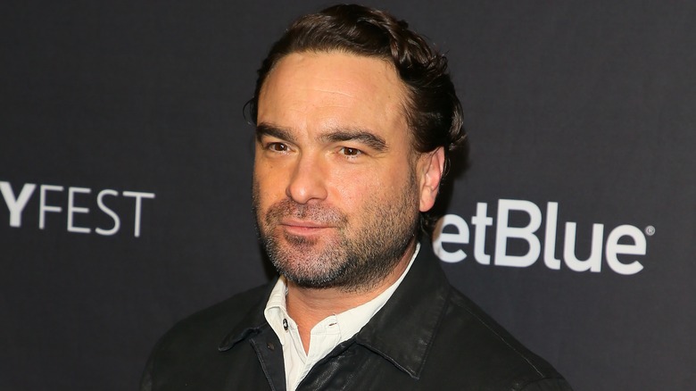 Johnny Galecki against black background