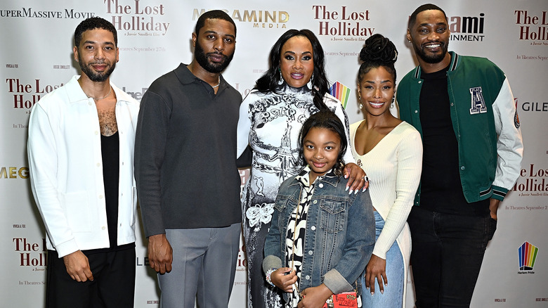 The Lost Holiday cast on the red carpet smiling