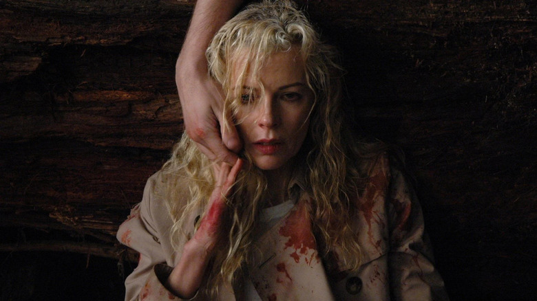 Kim Basinger in bloody coat