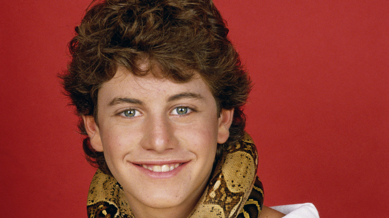 Kirk Cameron with snake coiled around neck