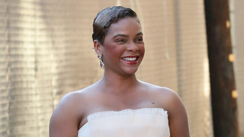 Lark Voorhies wearing white dress