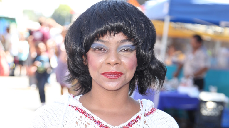 Lark Voorhies smiling with black hair