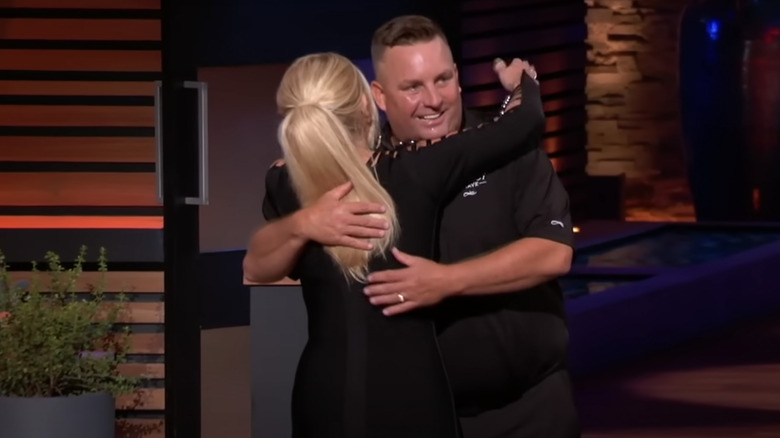 Lori Grenier hugging Mike Gutow